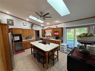 Executive home surrounded by city land